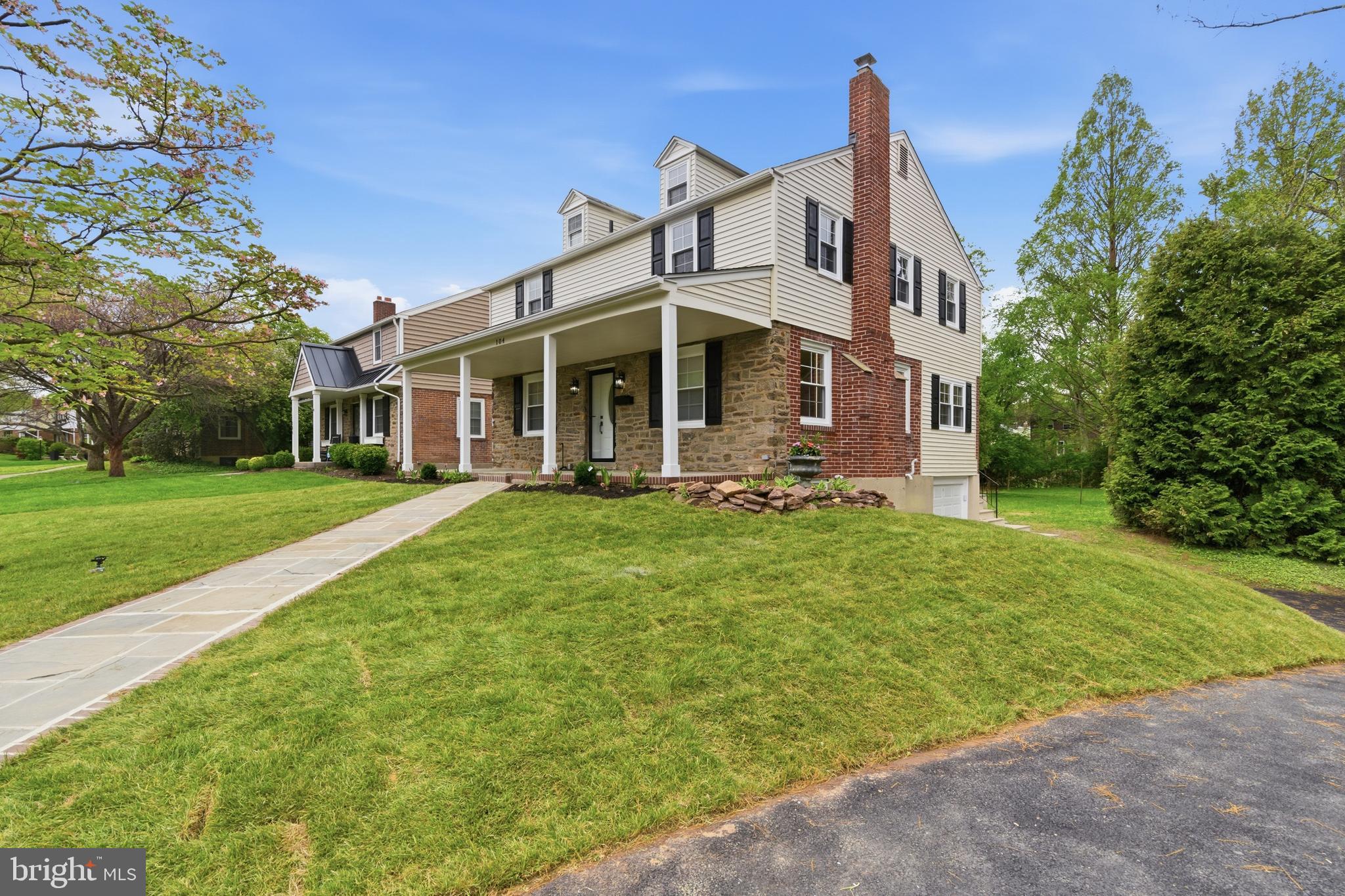 104 Atwood Road Flourtown, PA 19031 - Photo 2 of 52 a front view of a house with garden