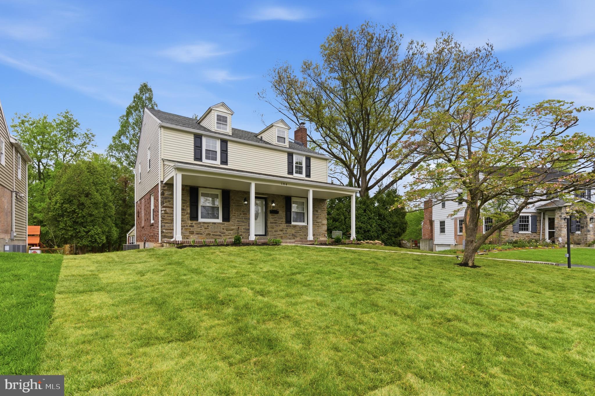 104 Atwood Road Flourtown, PA 19031 - Photo 3 of 52 a front view of a house with a garden