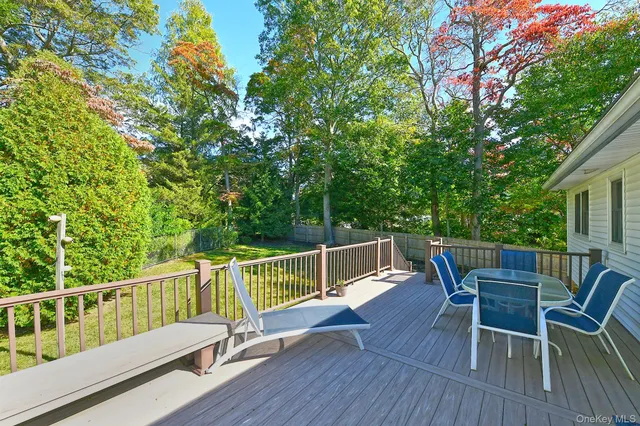 a view of a backyard with sitting area