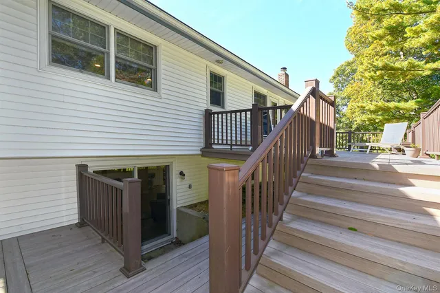 a view of a house with wooden fence