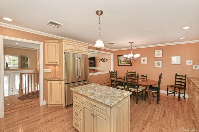 a open kitchen with a table and chairs in it