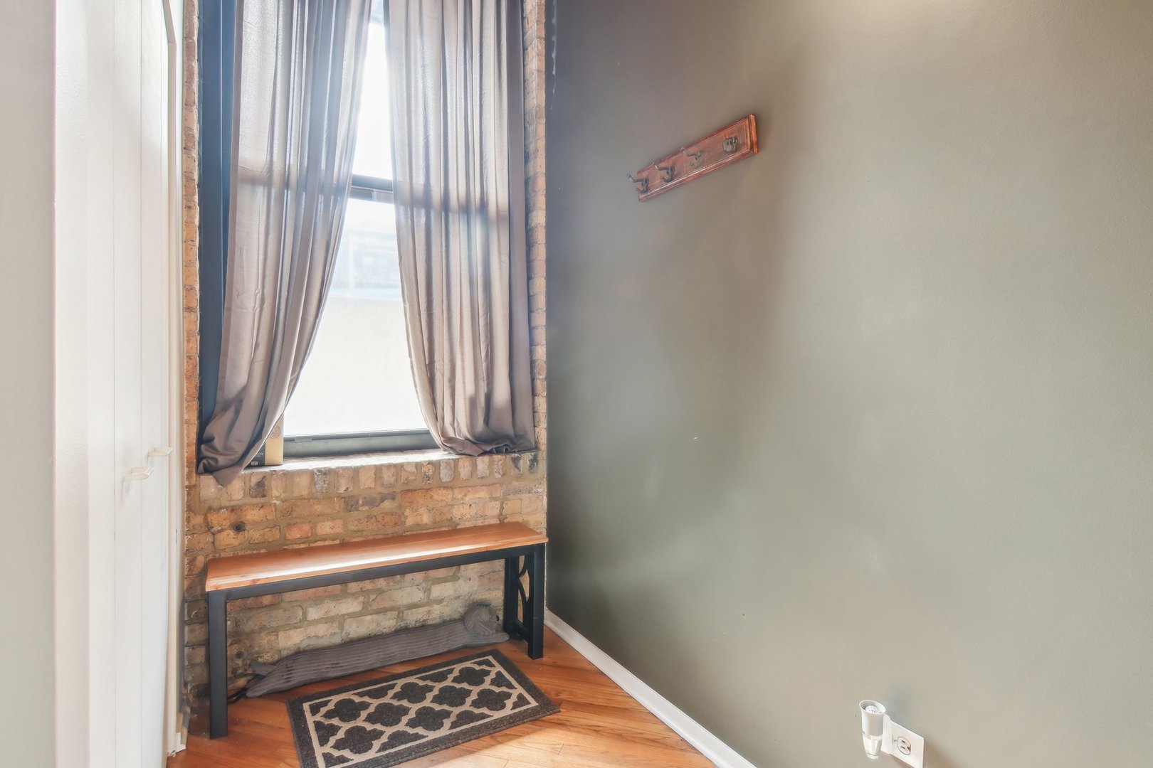 226 North Clinton Street, Unit 216 Chicago, IL 60661 - Photo 13 of 21 a bathroom with a window and a shower