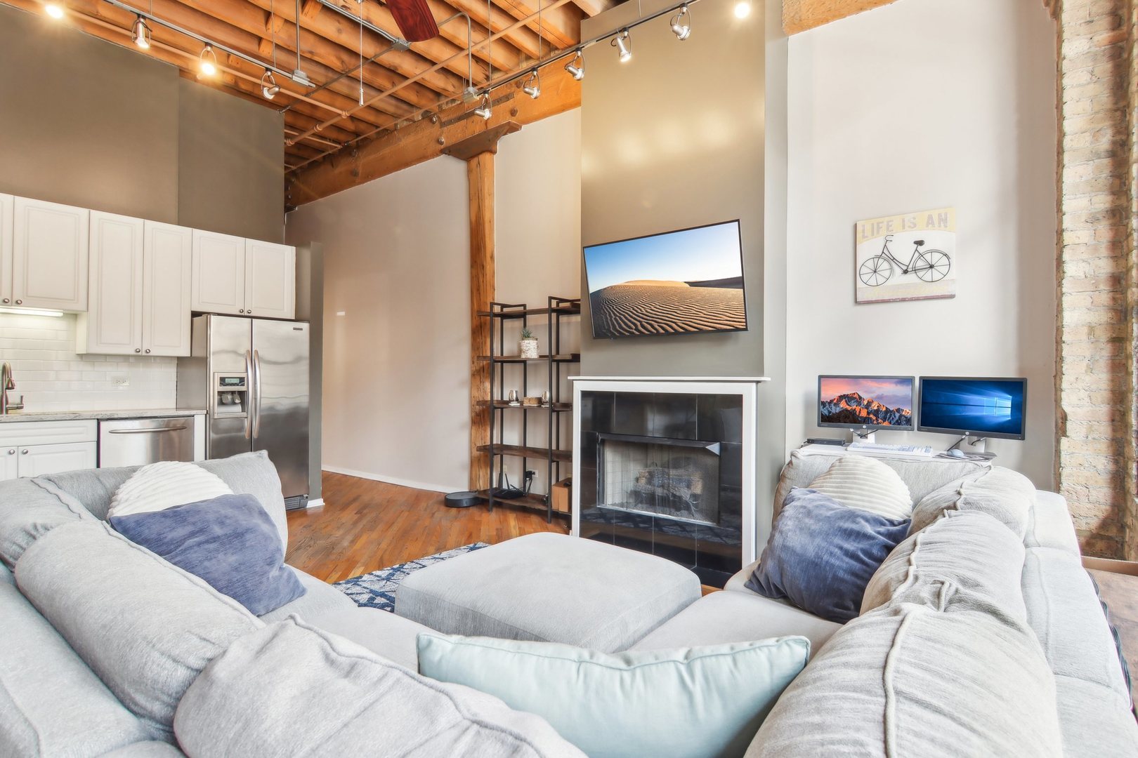 226 North Clinton Street, Unit 216 Chicago, IL 60661 - Photo 5 of 21 a living room with furniture and a fireplace