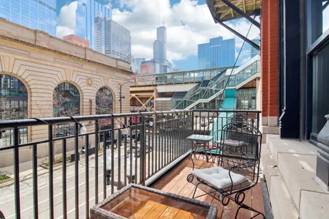 a view of a balcony with furniture