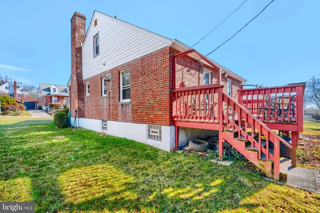 a balcony with lots of green space and white walls