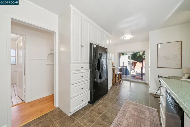 a kitchen with a sink and a stove top oven