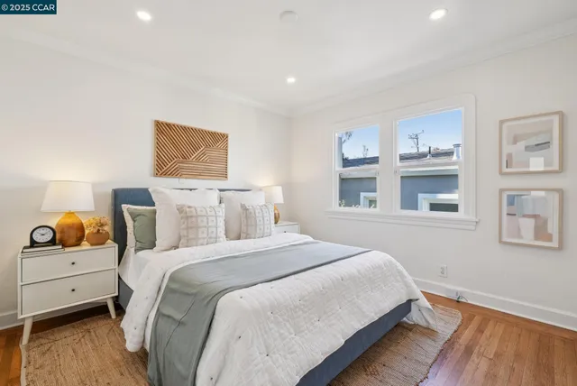 a bedroom with a bed and a lamp