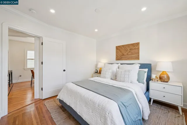 a bedroom with a bed and a table in it