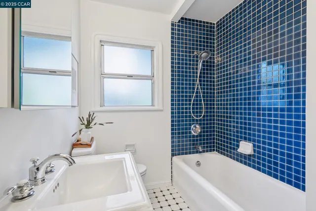 a view of a wooden deck with large trees