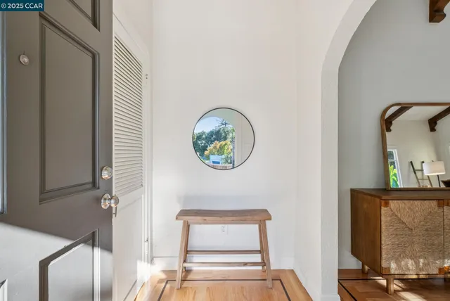 a view of staircase with a rug and a window