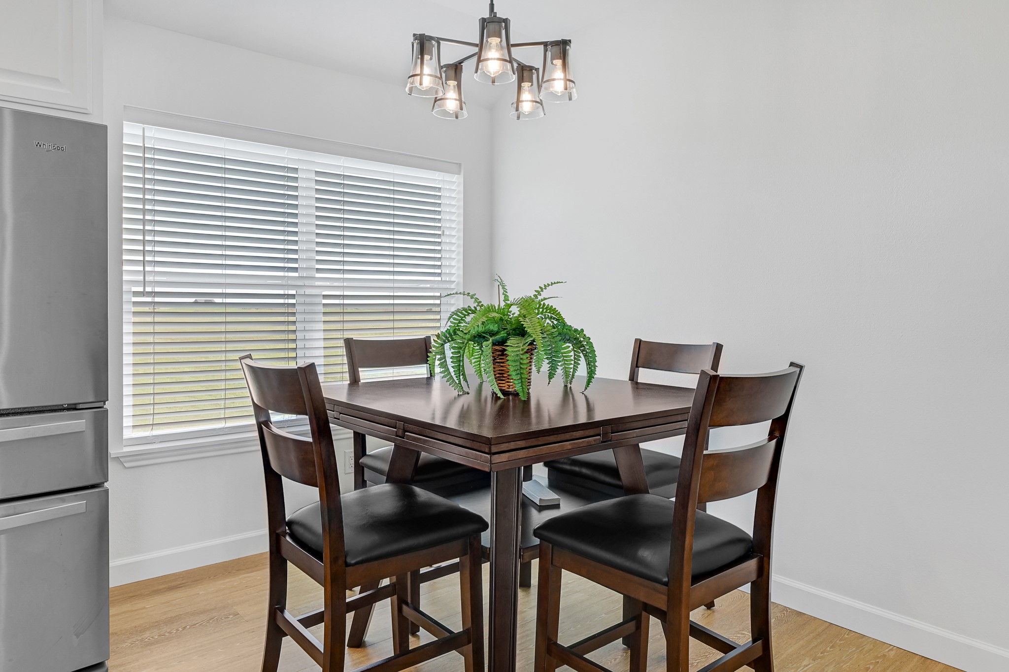 747 Waypoint Drive Palacios, TX 77465 - Photo 17 of 45 a dining room with furniture and potted plants