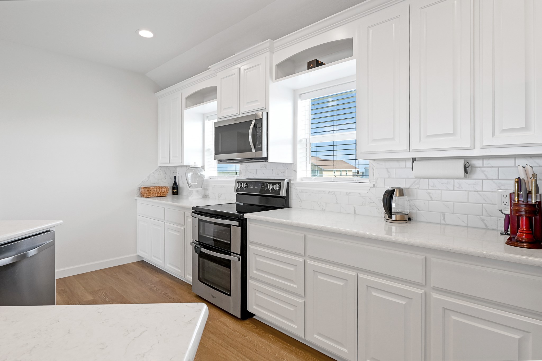747 Waypoint Drive Palacios, TX 77465 - Photo 18 of 45 a kitchen with stainless steel appliances granite countertop grey cabinets a stove a sink and dishwasher