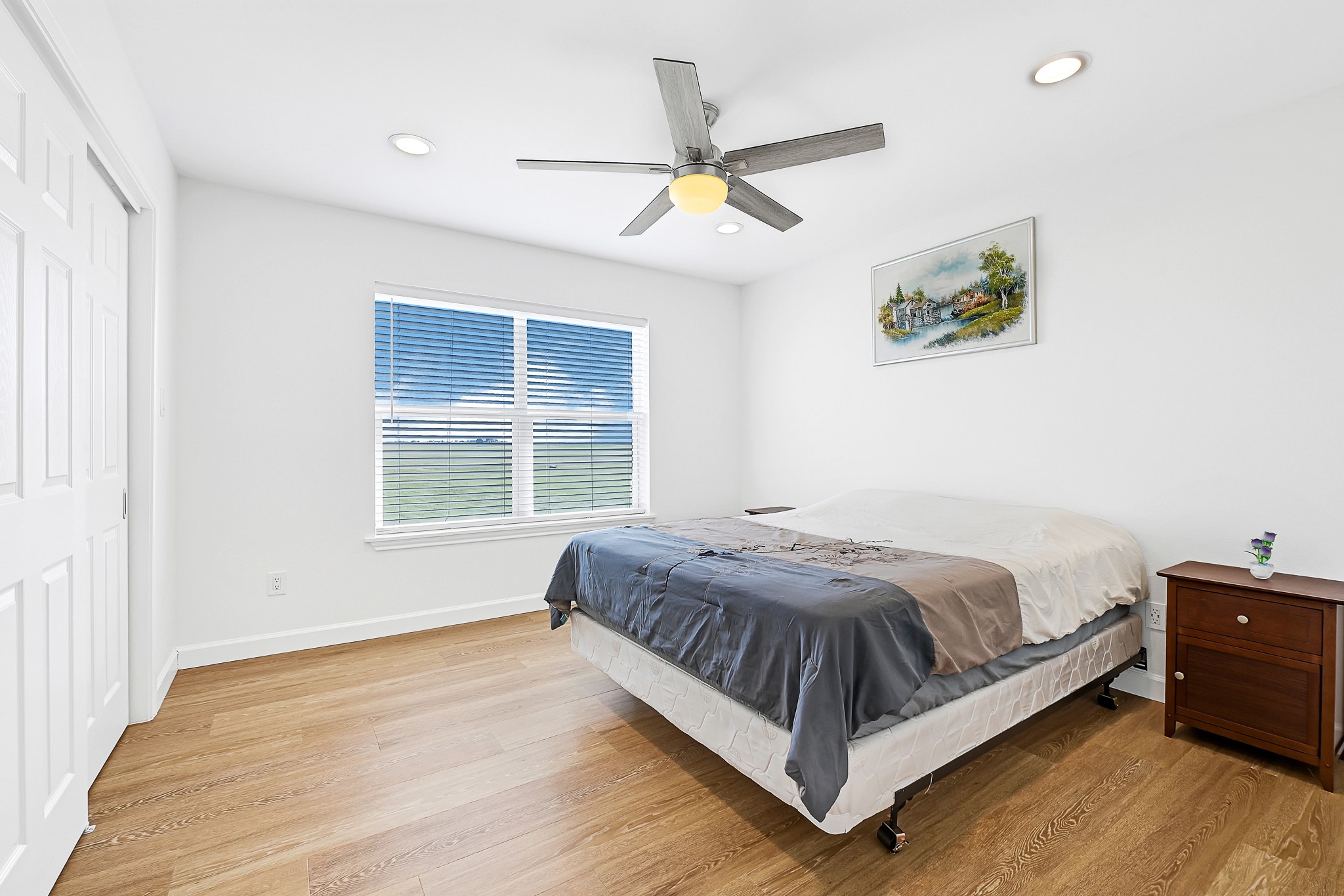 747 Waypoint Drive Palacios, TX 77465 - Photo 35 of 45 a large bed sitting in a bedroom next to a window