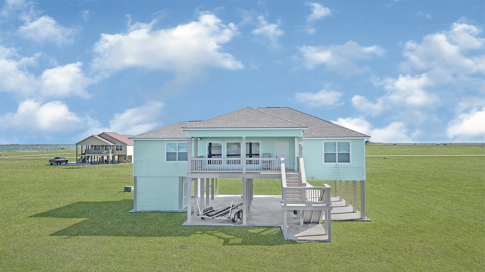 747 Waypoint Drive Palacios, TX 77465 - Photo 38 of 45 a front view of a house with a garden and yard