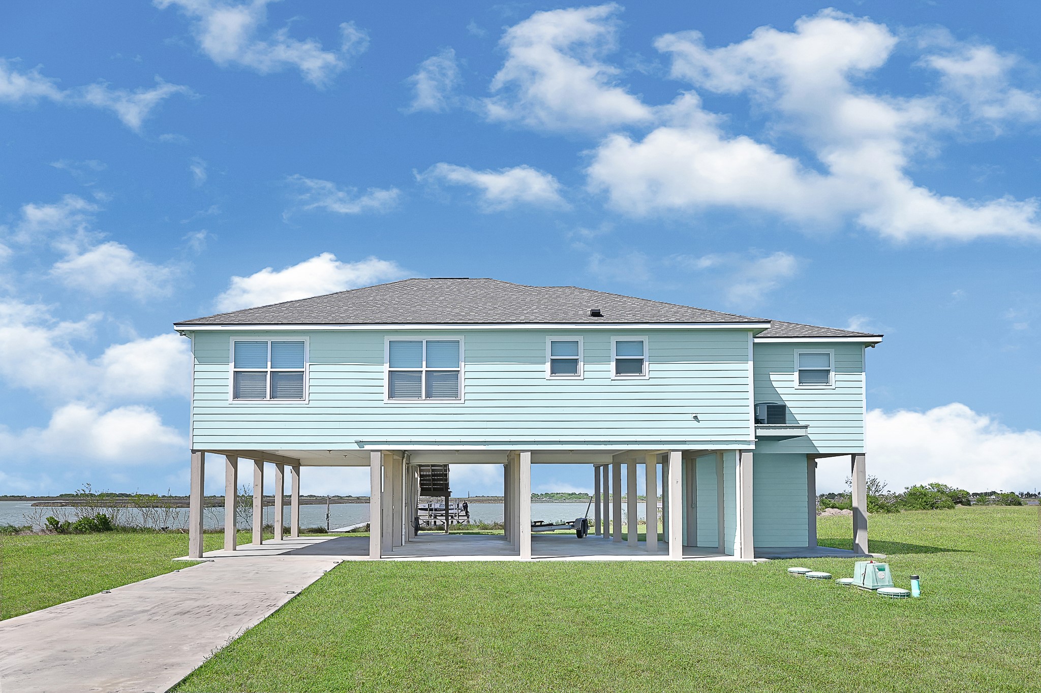 747 Waypoint Drive Palacios, TX 77465 - Photo 7 of 45 a front view of a house with a garden