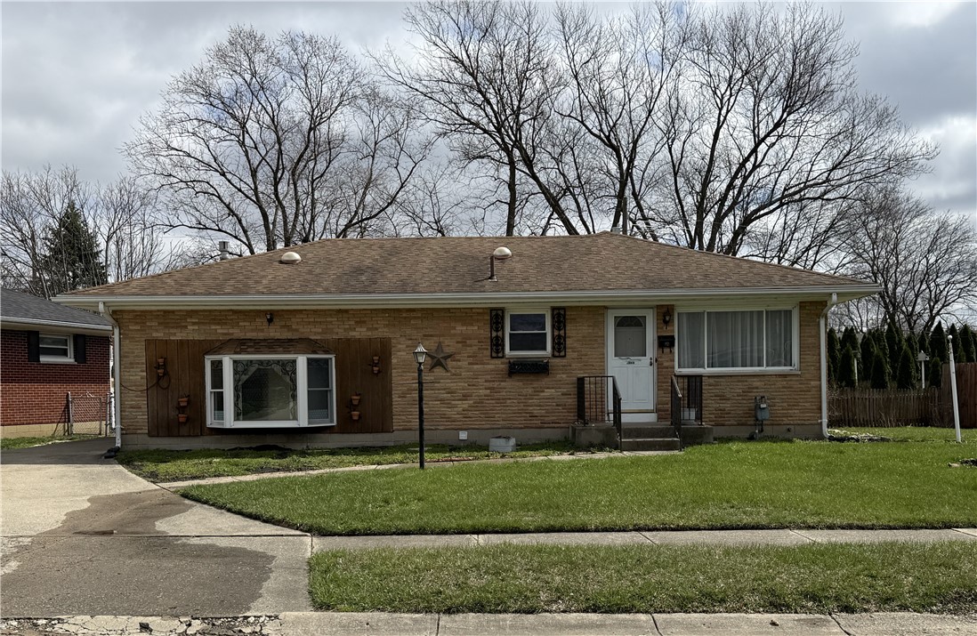 4732 Lehigh Drive Springfield, OH 45503 - Photo 4 of 27 This charming residence features classic brick construction and a well-maintained lawn.