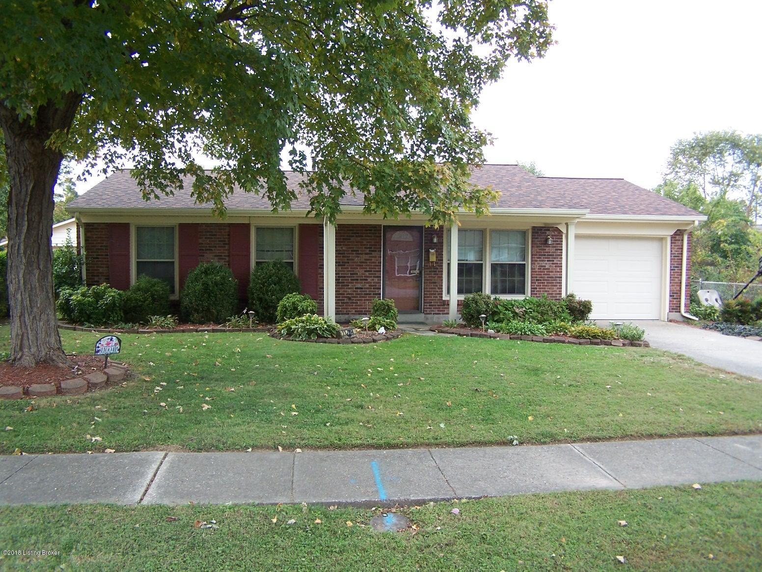 11004 Torrington Road Louisville, KY 40272 - Photo 3 of 43 Front view of this all brick 3 Bedroom home with 1 updated Full Bath, Living Room, added Family Room on the back, Eat-In Area in Kitchen, Laundry Room, 1 Car Attached Garage, Covered Front Porch, Replacement Windows, ALL new Carpeting, New Paint, Fully Fenced Back Yard, Utility Shed and an above ground pool with a tanning deck.