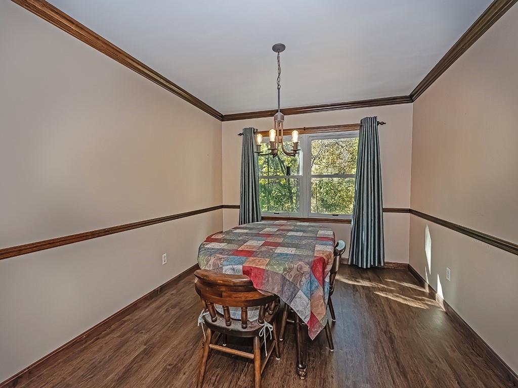 380 Woodland Road Apollo, PA 15613 - Photo 13 of 28 a view of a dining room with furniture window and wooden floor