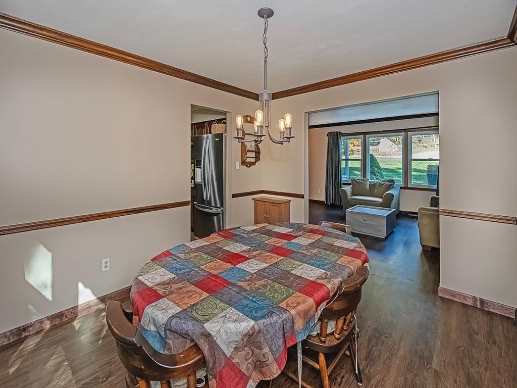 380 Woodland Road Apollo, PA 15613 - Photo 14 of 28 a bedroom with a bed and chandelier