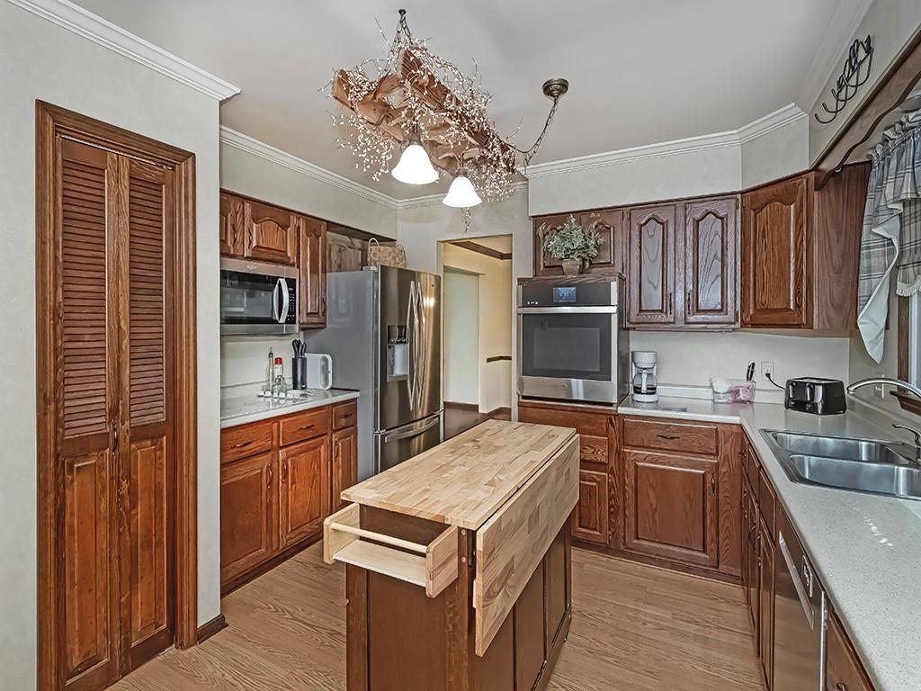 380 Woodland Road Apollo, PA 15613 - Photo 15 of 28 a kitchen with stainless steel appliances granite countertop a sink stove and refrigerator