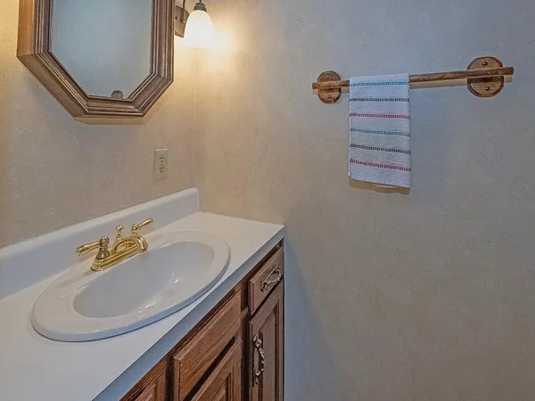 a bathroom with a sink and mirror