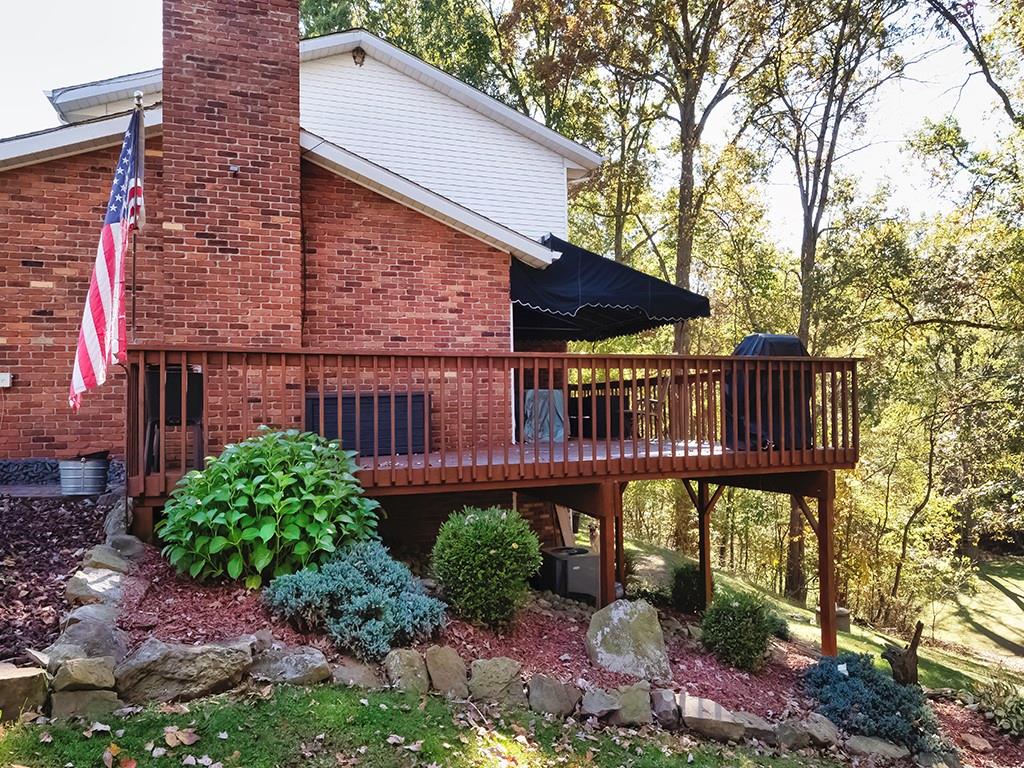 380 Woodland Road Apollo, PA 15613 - Photo 4 of 28 a view of a street with wooden fence and plants