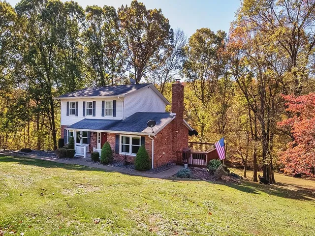 a view of a house with swimming pool