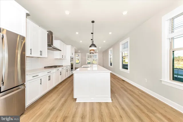 a view of kitchen with wooden floor and window