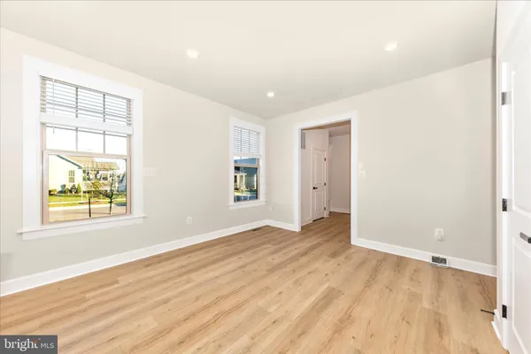a bedroom with a bed and a cabinets