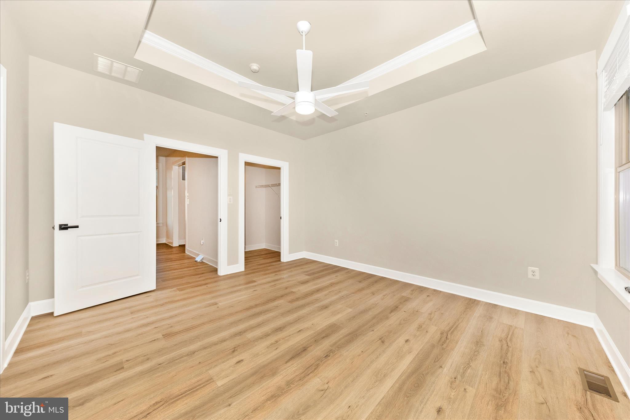 413 Bucklebury Lane Frederick, MD 21702 - Photo 22 of 58 a view of an empty room with wooden floor