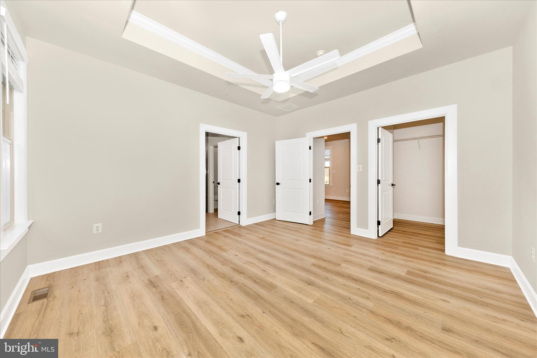 413 Bucklebury Lane Frederick, MD 21702 - Photo 23 of 58 a view of an empty room with wooden floor