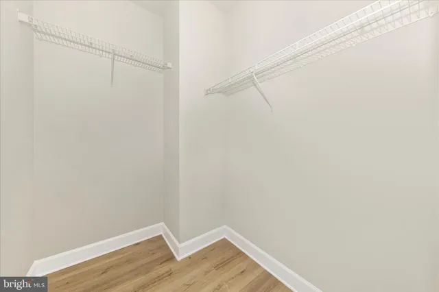 a bathroom with a double vanity sink a mirror and shower