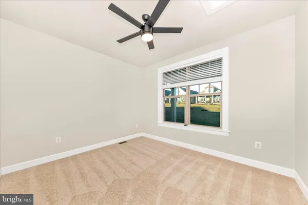 an empty room with fan