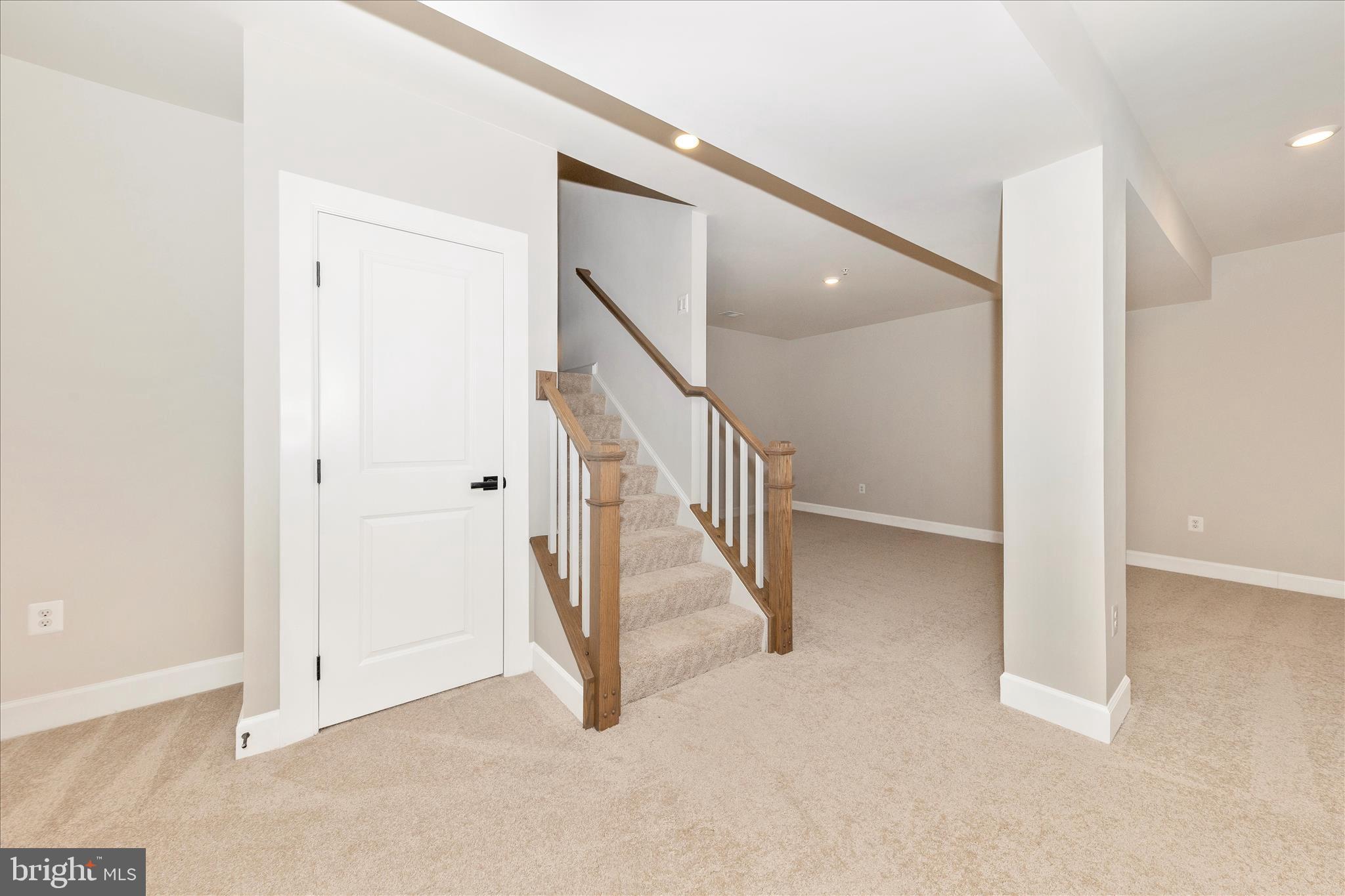 413 Bucklebury Lane Frederick, MD 21702 - Photo 37 of 58 a view of a hallway with staircase