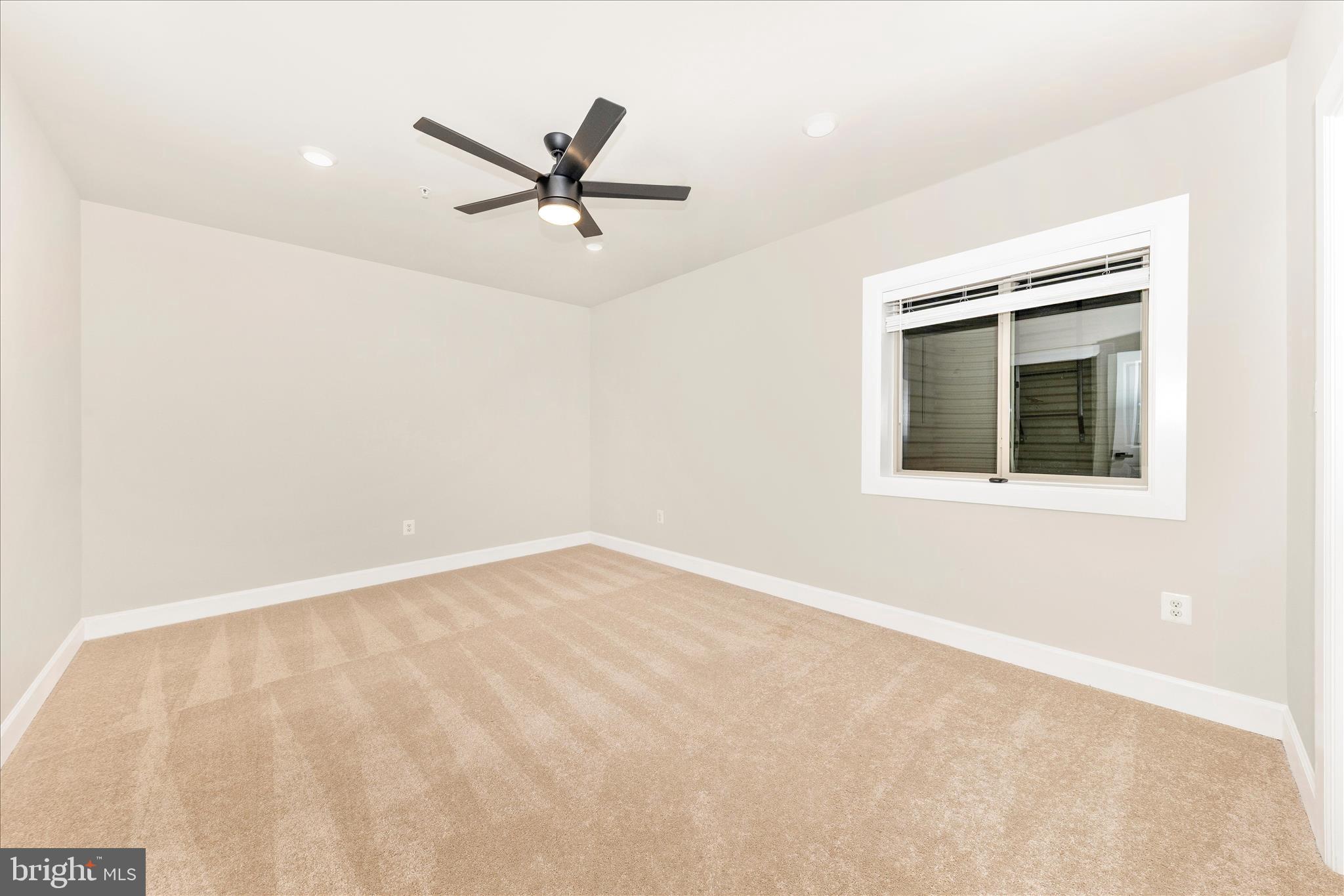 413 Bucklebury Lane Frederick, MD 21702 - Photo 44 of 58 a view of an empty room with a window