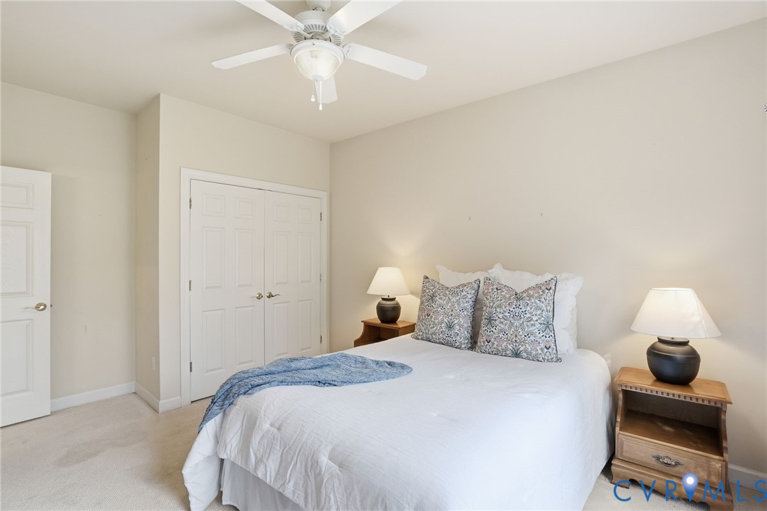 14430 Overlook Ridge Lane Beaverdam, VA 23015 - Photo 46 of 71 a bedroom with a bed and a lamp