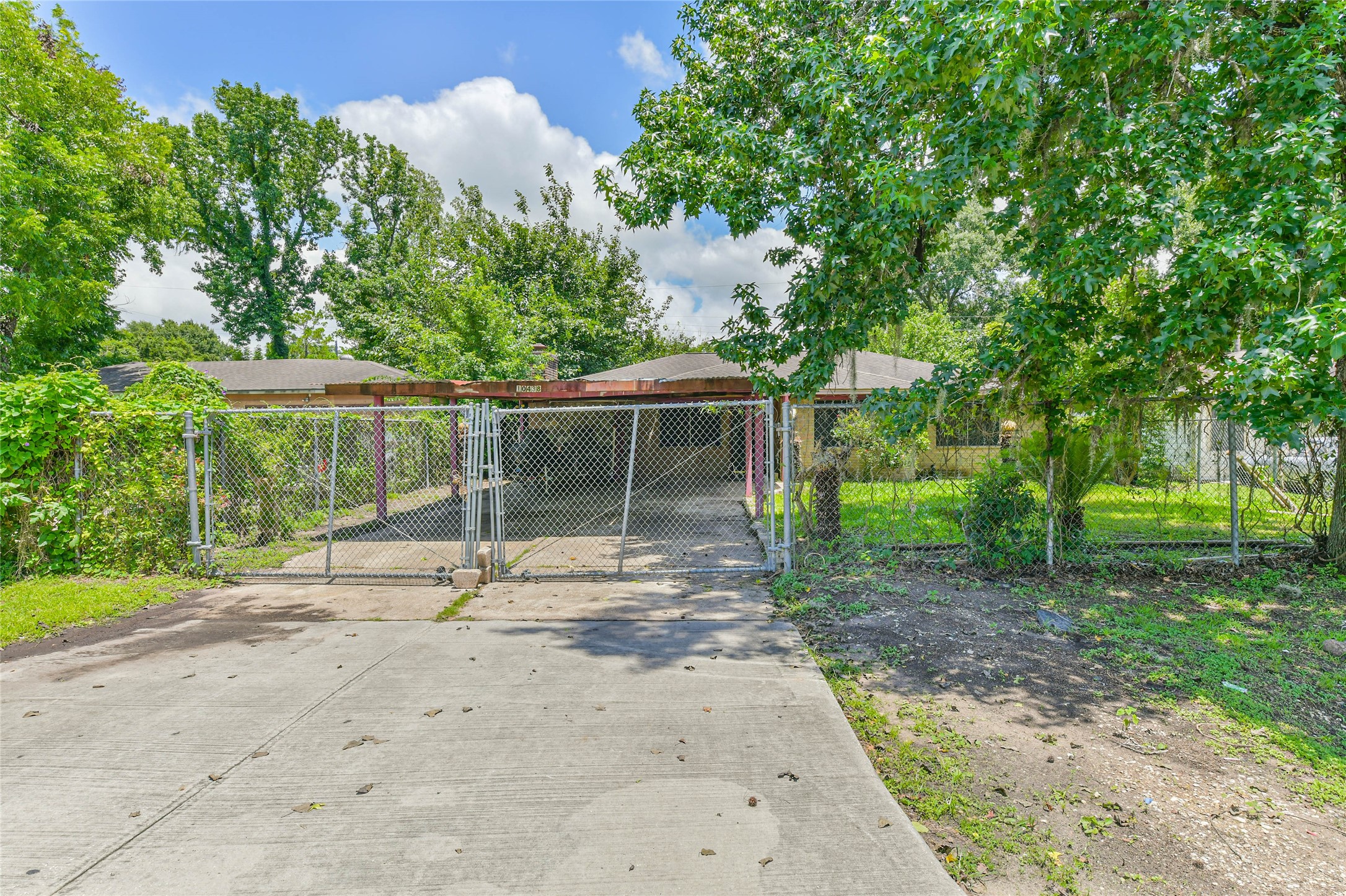 10438 Caxton Street Houston, TX 77016 - Photo 3 of 24 a house with trees in the background