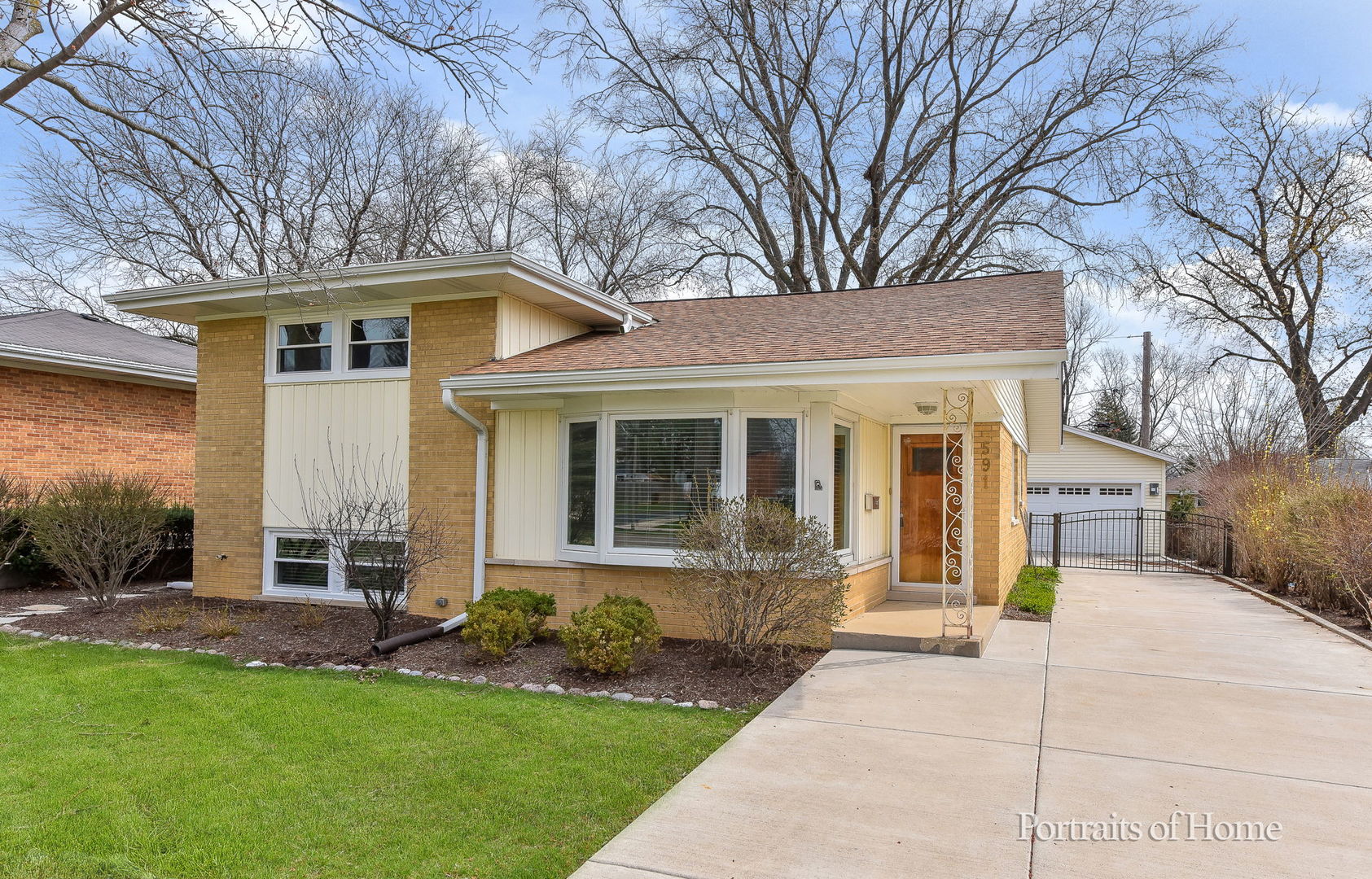 a front view of a house with a yard