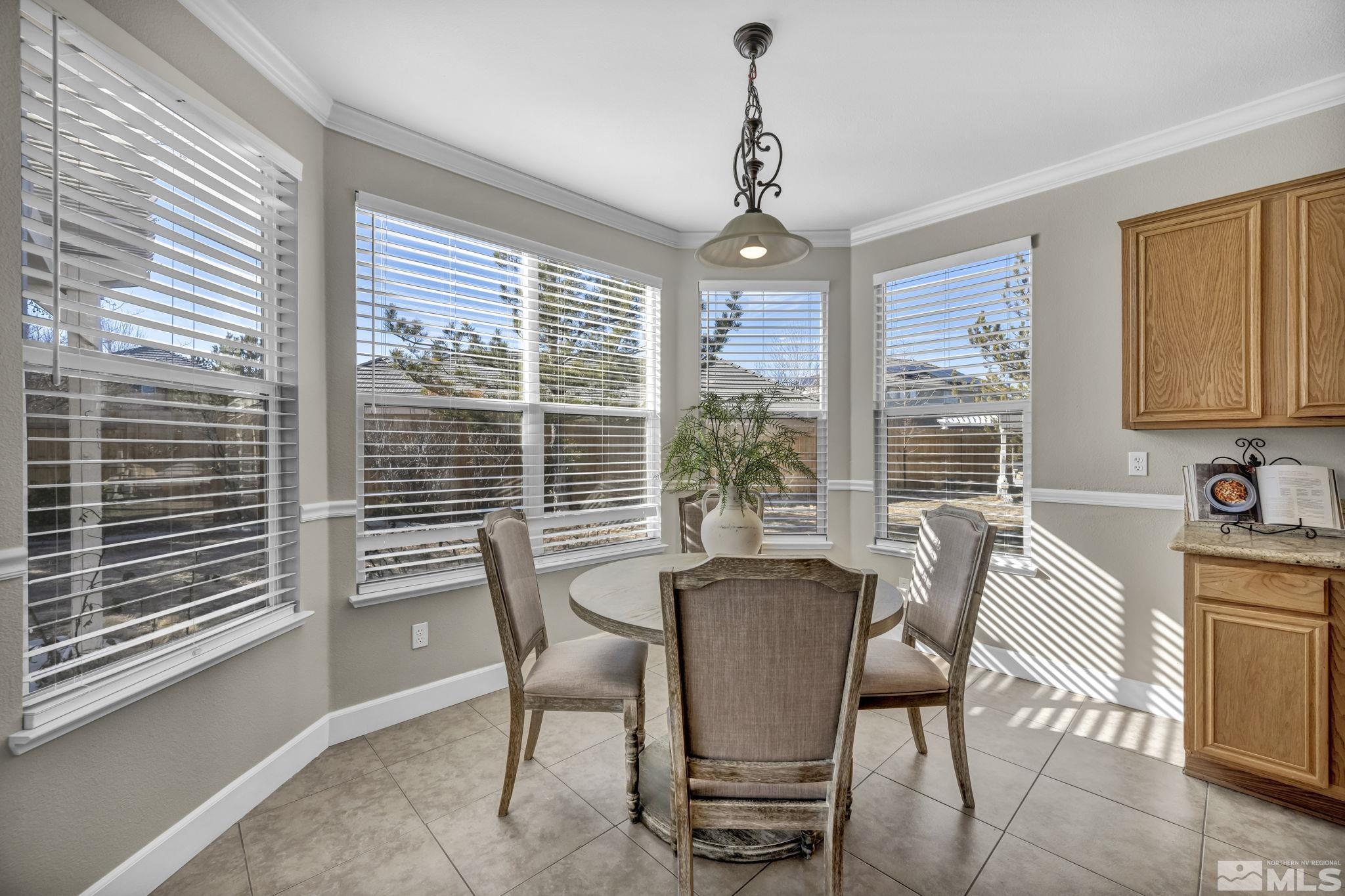 9765 Rolling Rock Court Reno, NV 89521 - Photo 13 of 39 a view of a dining room with furniture window and outside view