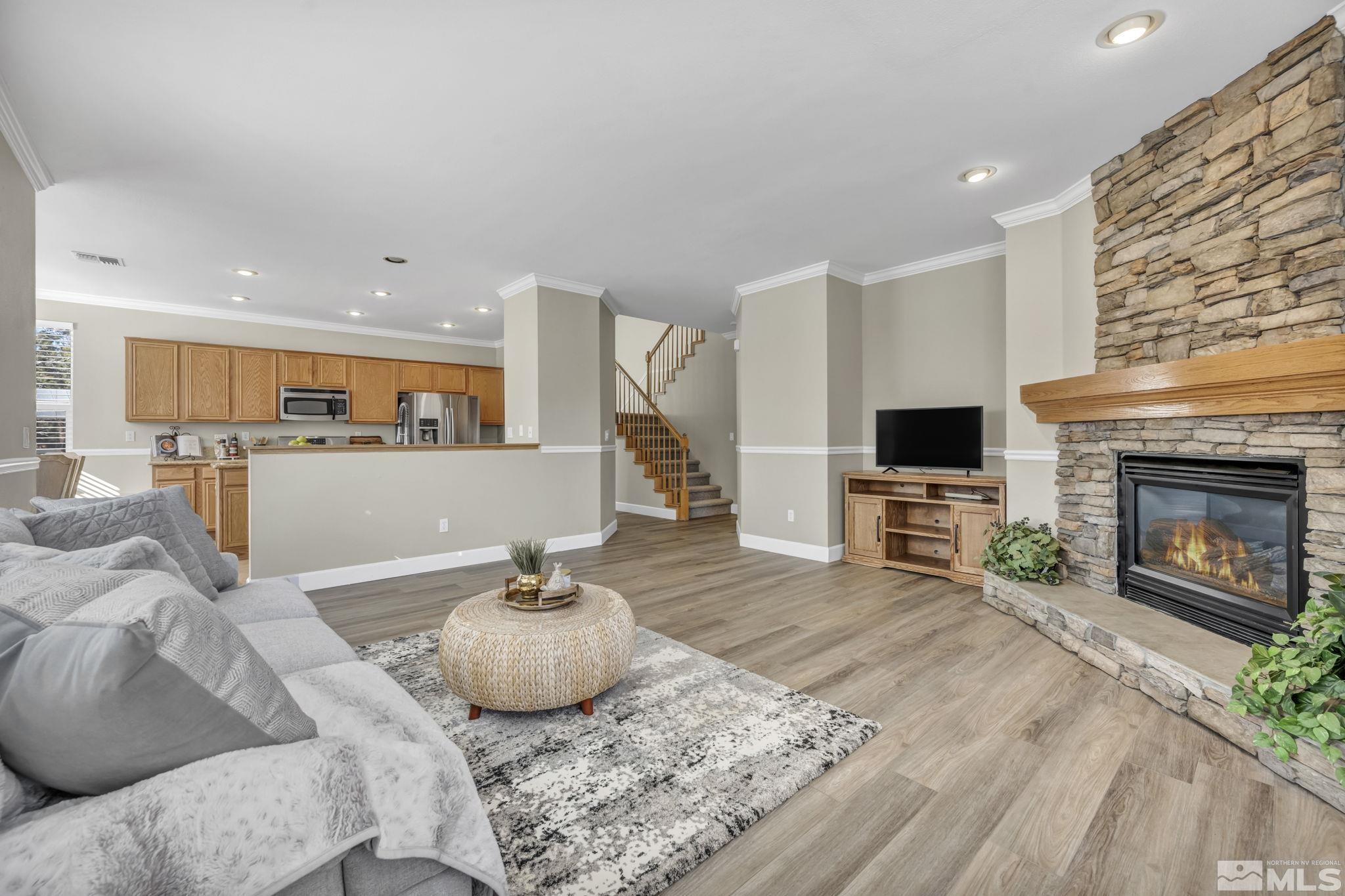 9765 Rolling Rock Court Reno, NV 89521 - Photo 14 of 39 a living room with furniture and a fireplace