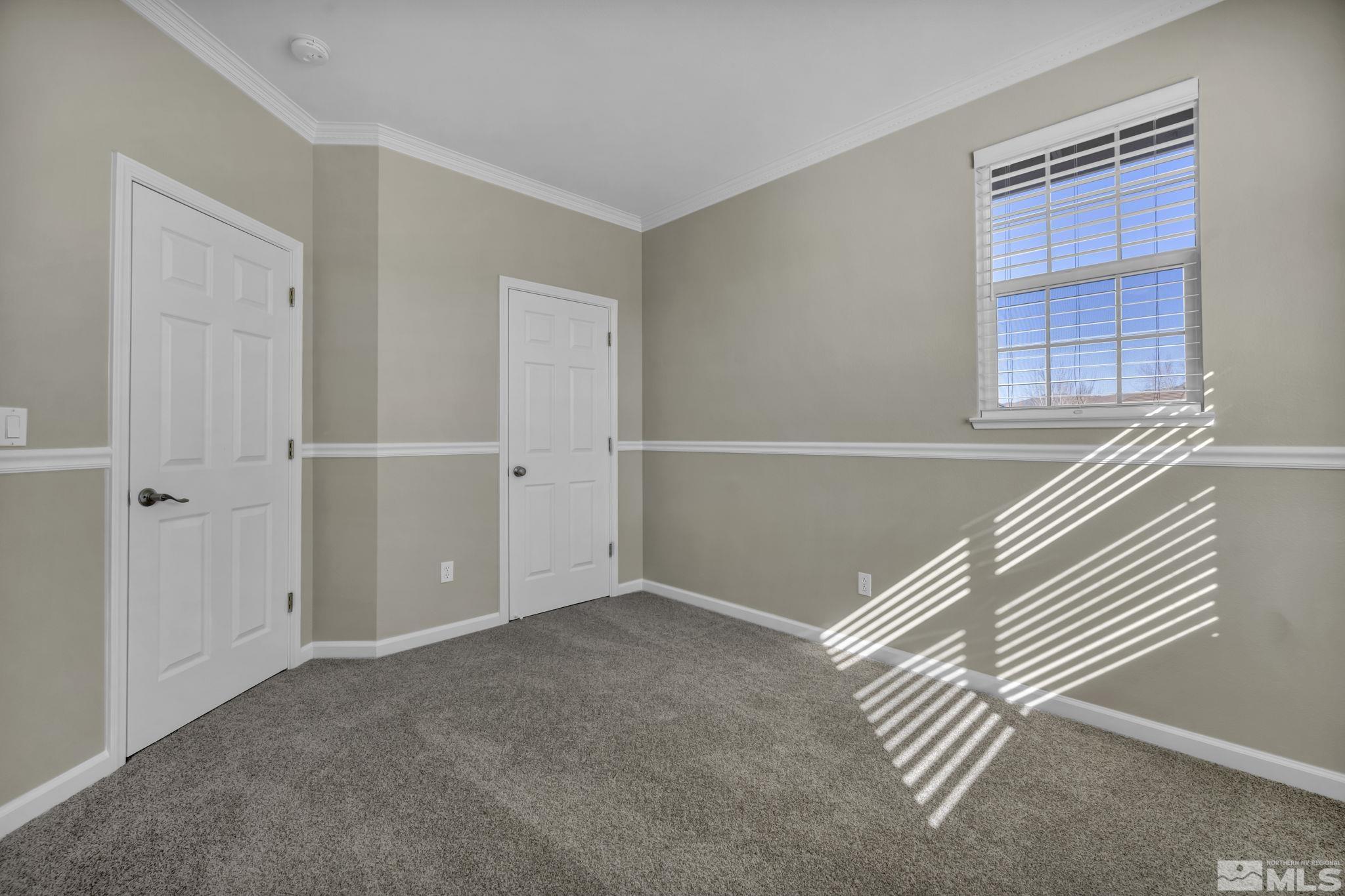 9765 Rolling Rock Court Reno, NV 89521 - Photo 23 of 39 an empty room with windows