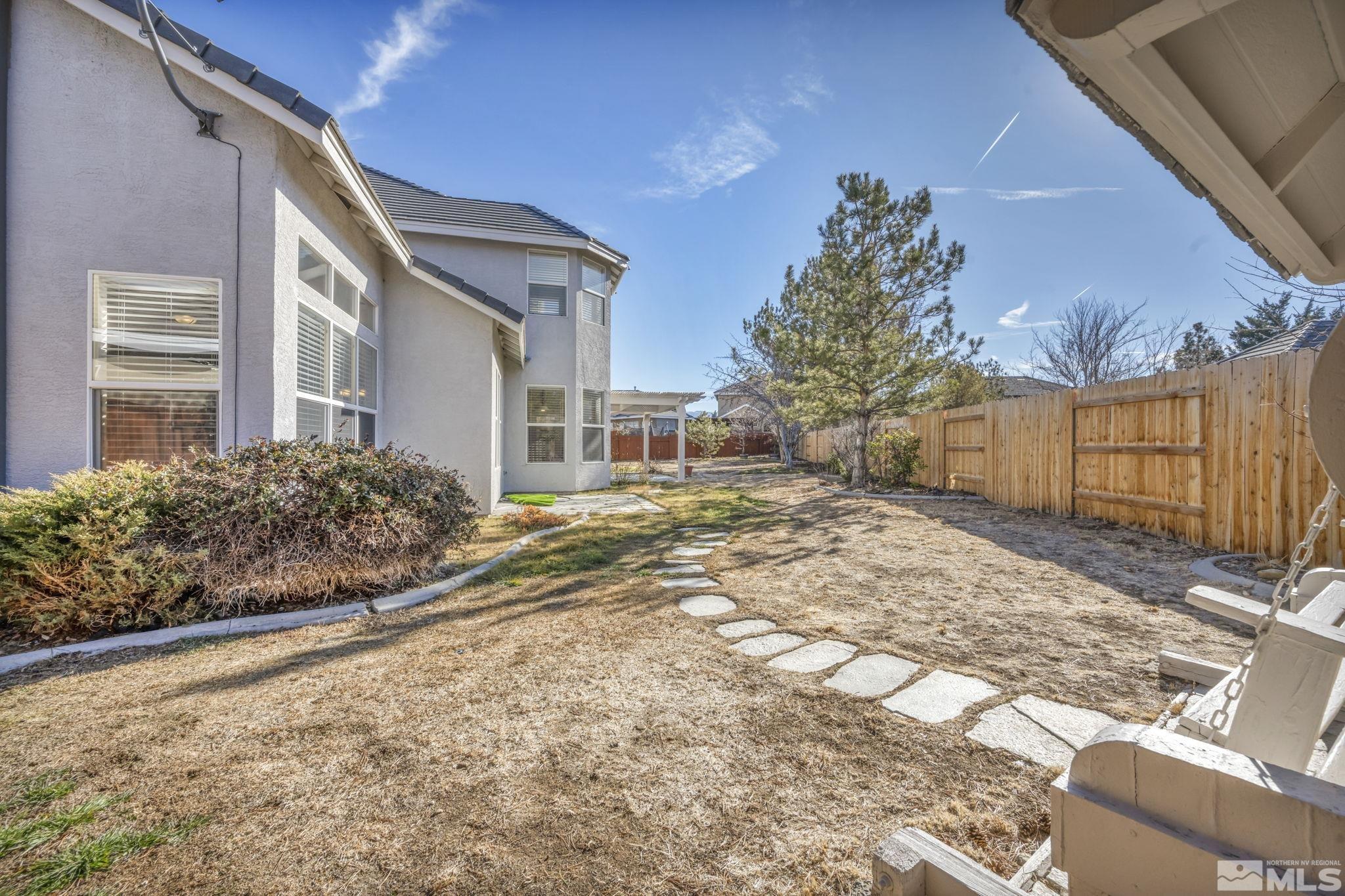 9765 Rolling Rock Court Reno, NV 89521 - Photo 27 of 39 a view of a house with a yard