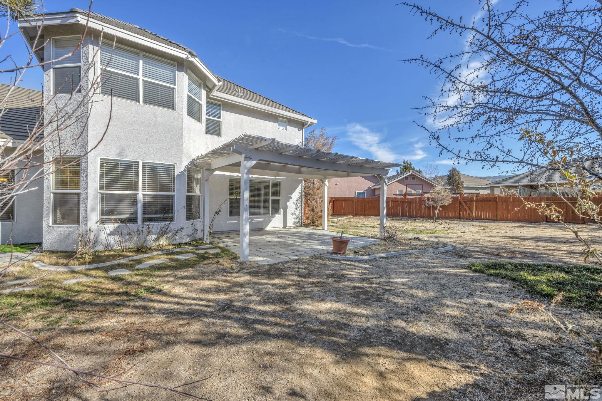9765 Rolling Rock Court Reno, NV 89521 - Photo 33 of 39 a view of a house with a yard
