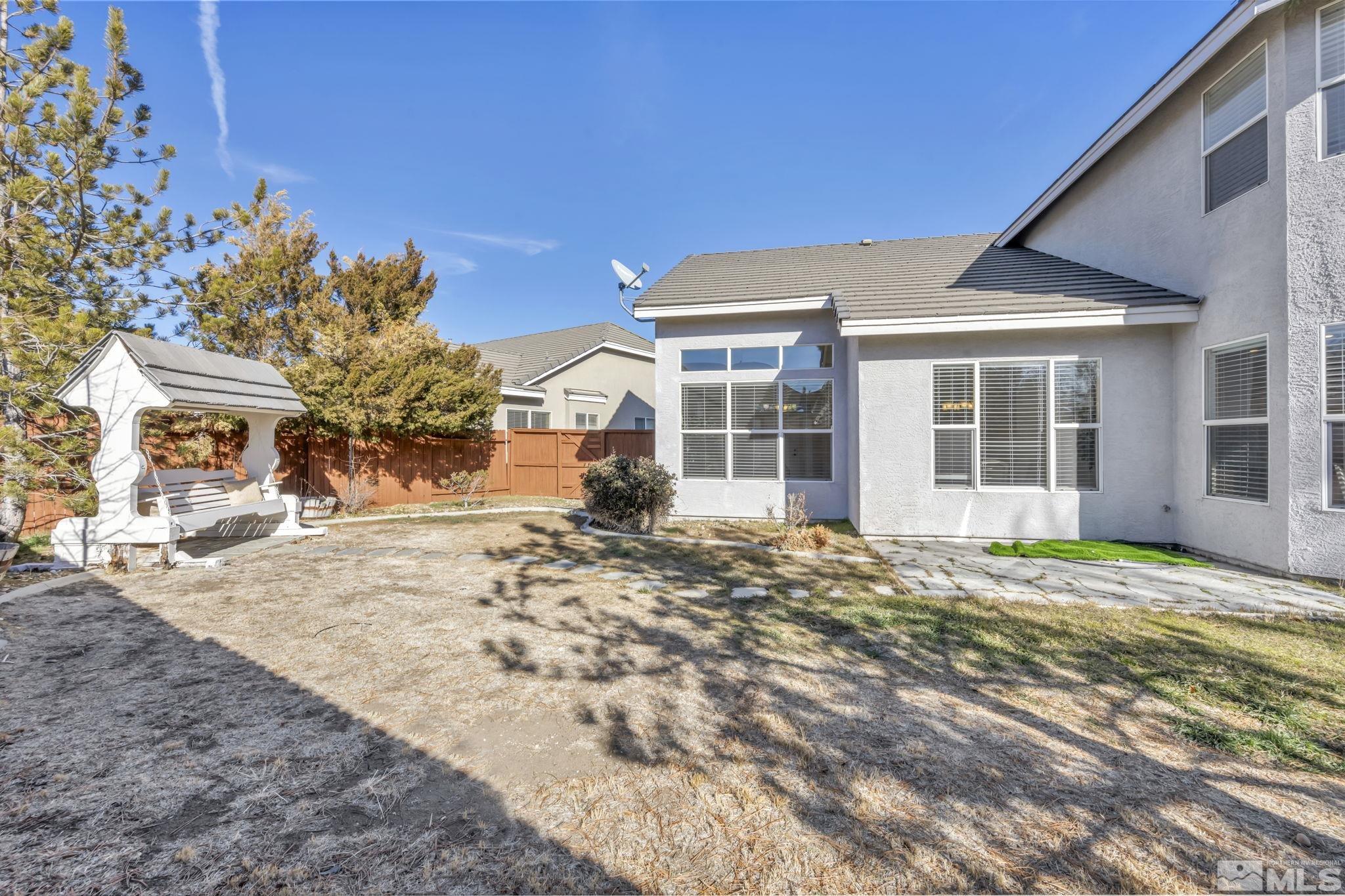 9765 Rolling Rock Court Reno, NV 89521 - Photo 34 of 39 a view of a house with a patio