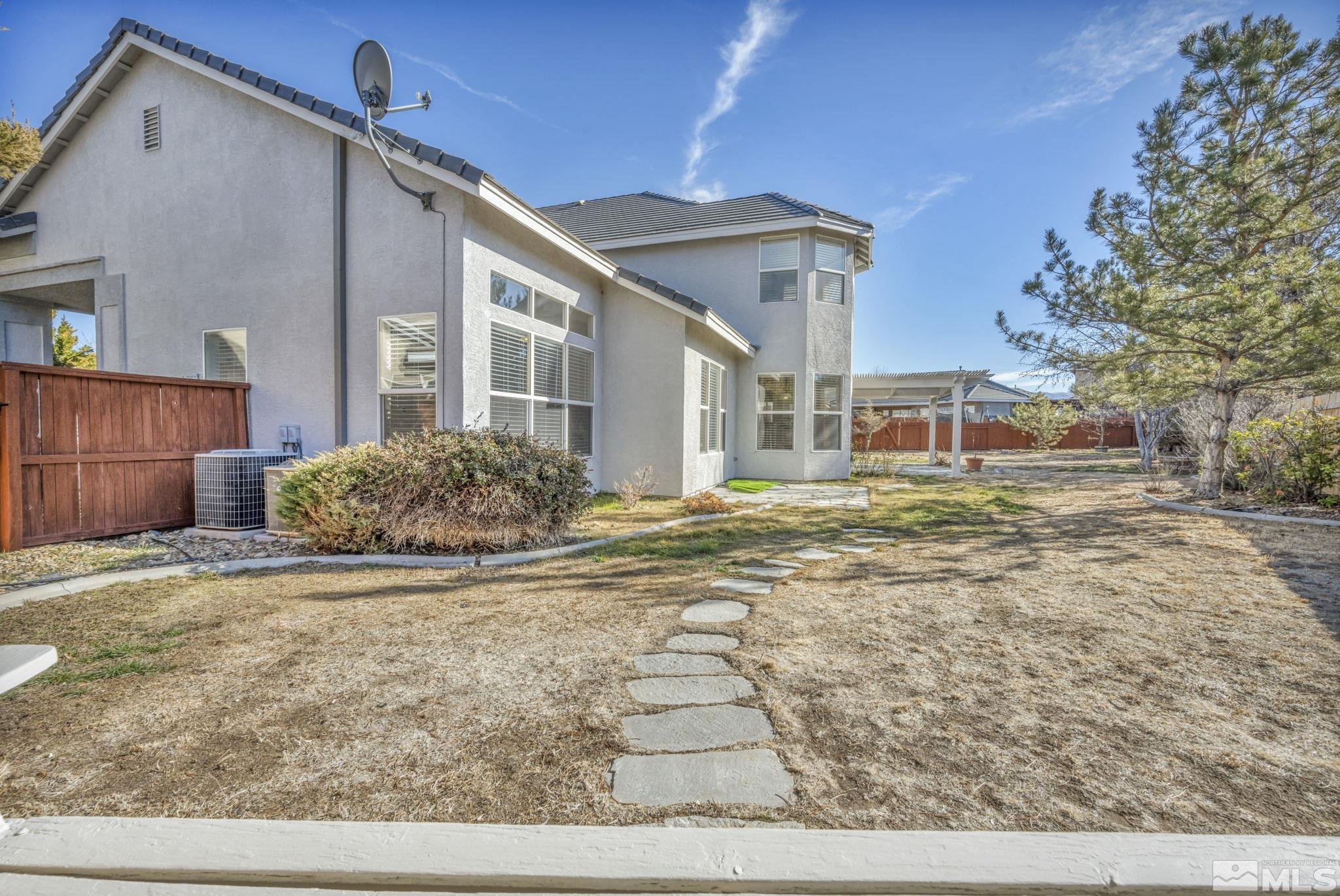 9765 Rolling Rock Court Reno, NV 89521 - Photo 36 of 39 a view of a house with a yard