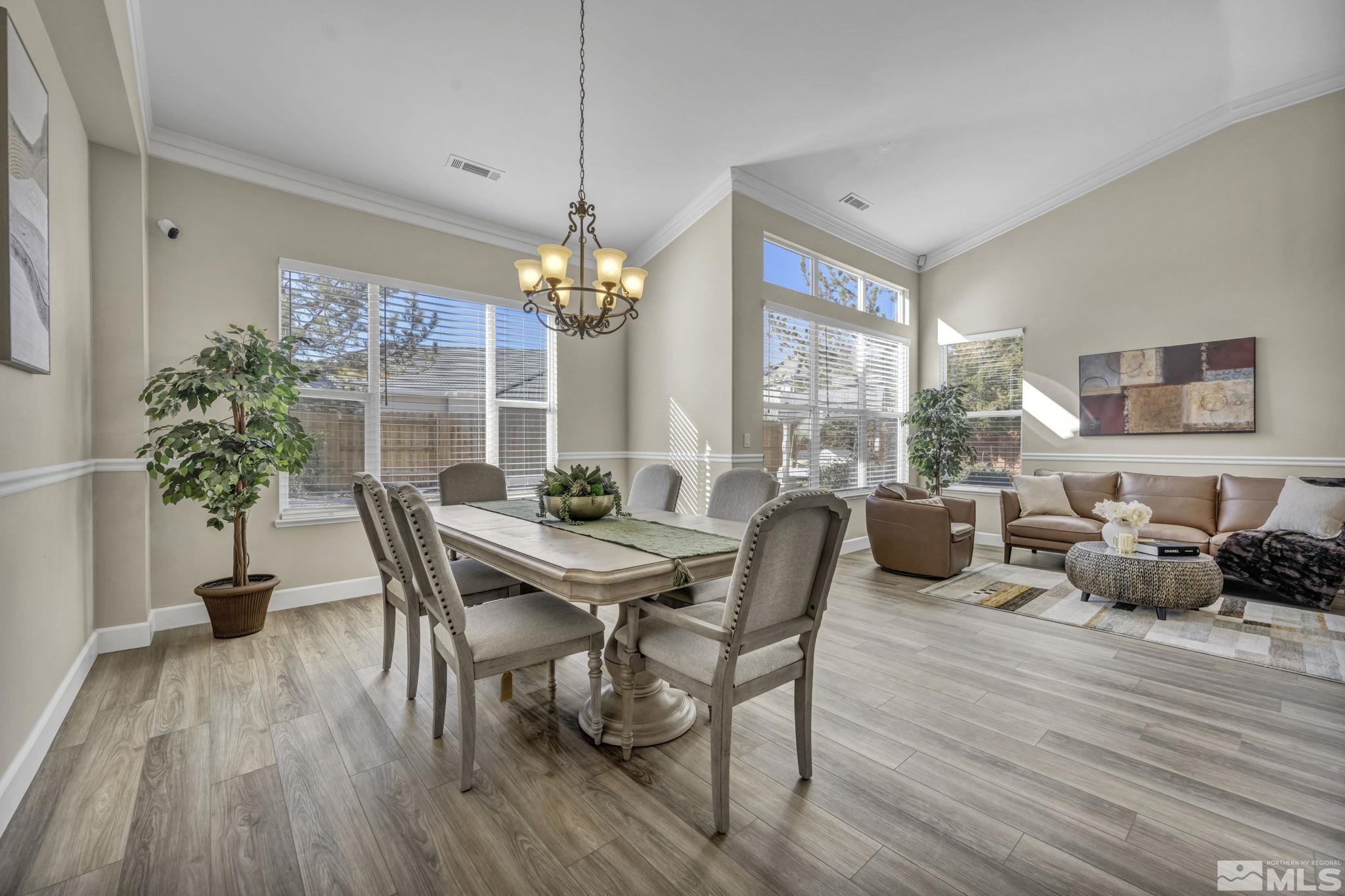 9765 Rolling Rock Court Reno, NV 89521 - Photo 8 of 39 a view of a dining room with furniture window and wooden floor