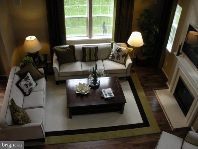4231 Forge Road Perry Hall, MD 21128 - Photo 3 of 10 a living room with furniture and a fireplace