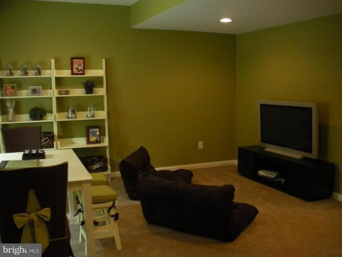 4231 Forge Road Perry Hall, MD 21128 - Photo 8 of 10 a living room with furniture and a flat screen tv