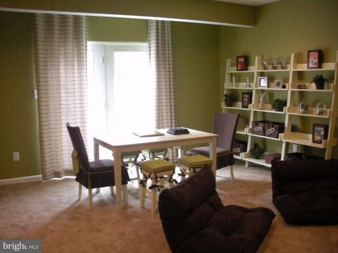 4231 Forge Road Perry Hall, MD 21128 - Photo 9 of 10 a living room with furniture and a lamp