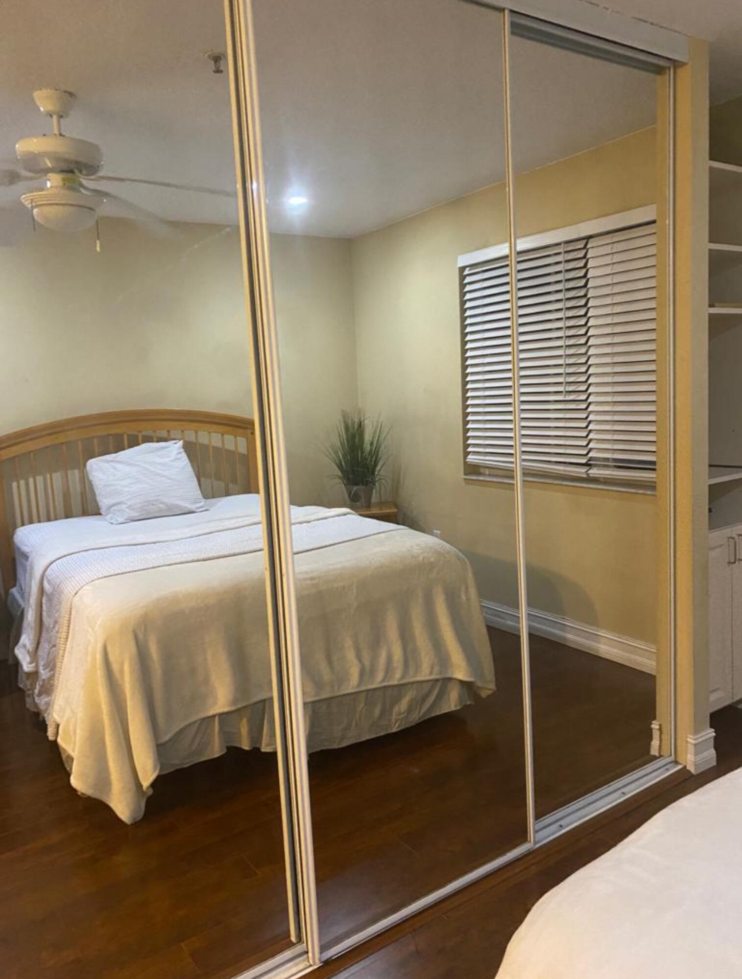 3111 Clint Moore Road, Unit 205 Boca Raton, FL 33496 - Photo 21 of 35 a bedroom with a bed and a window
